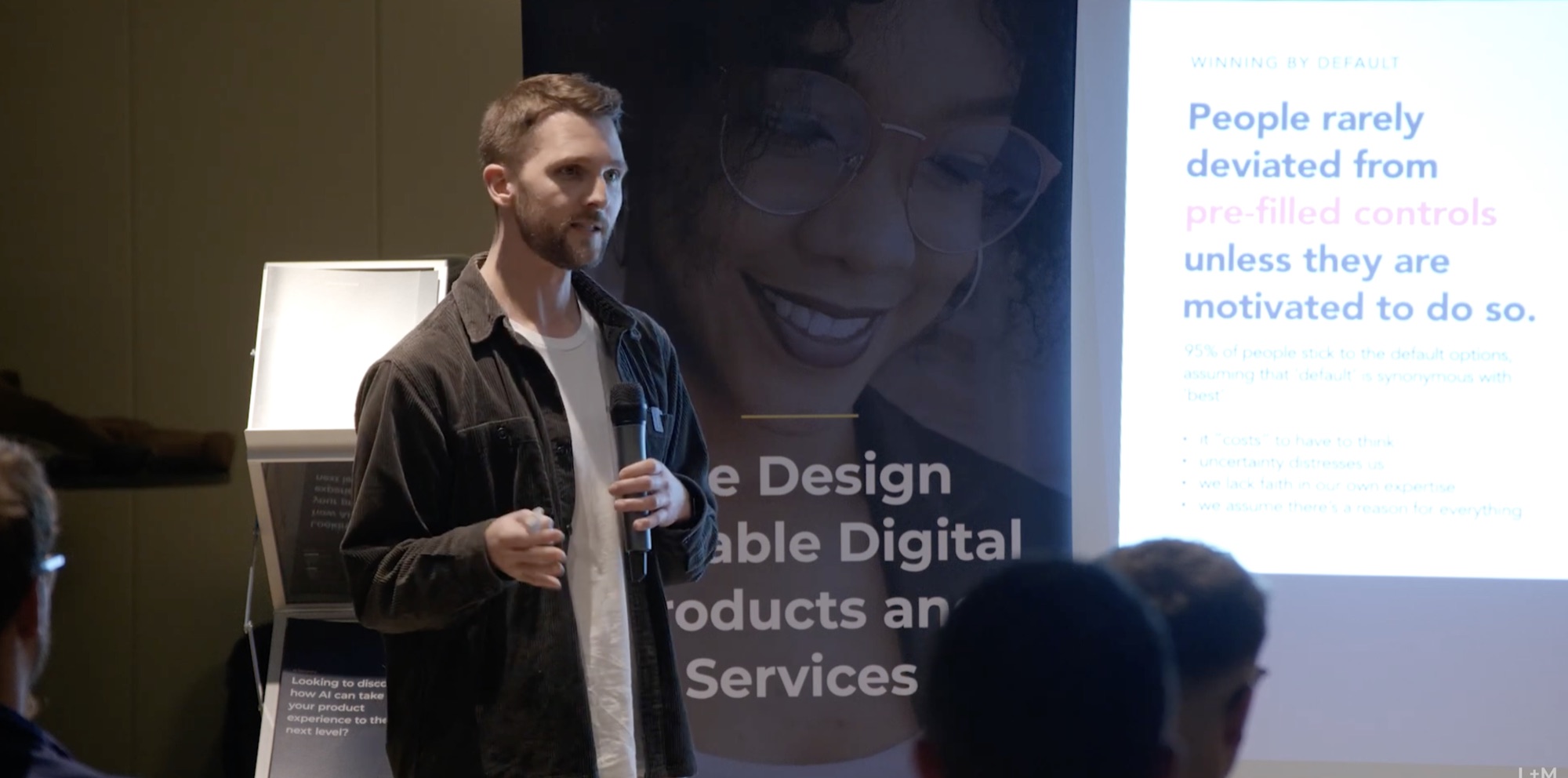 Alec Barr speaking on defaults and choice architecture at DX Shots Leeds 2023