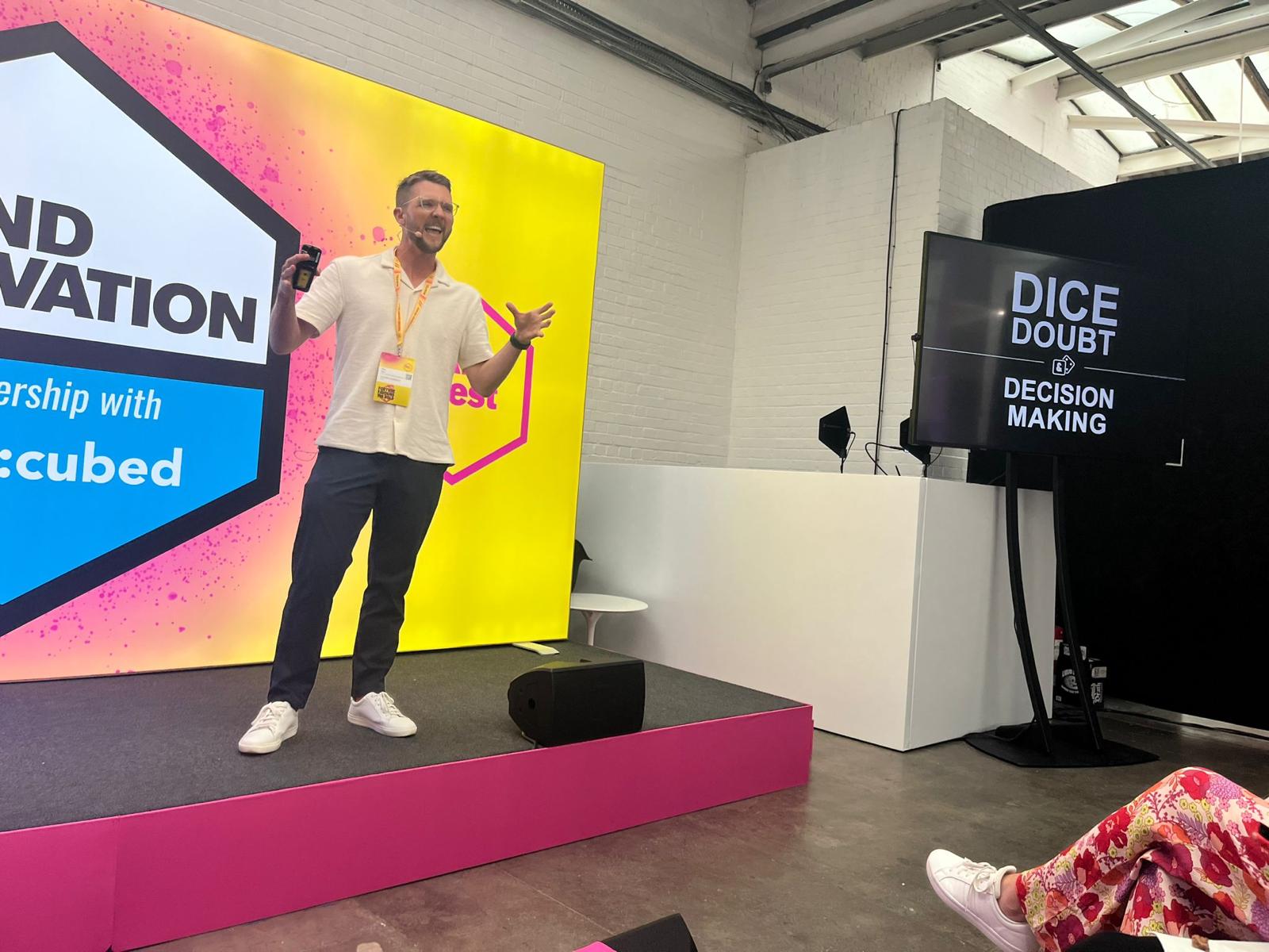 Alec Barr on stage for Dice, Doubt & Decision-Making at MAD//Fest London 2024
